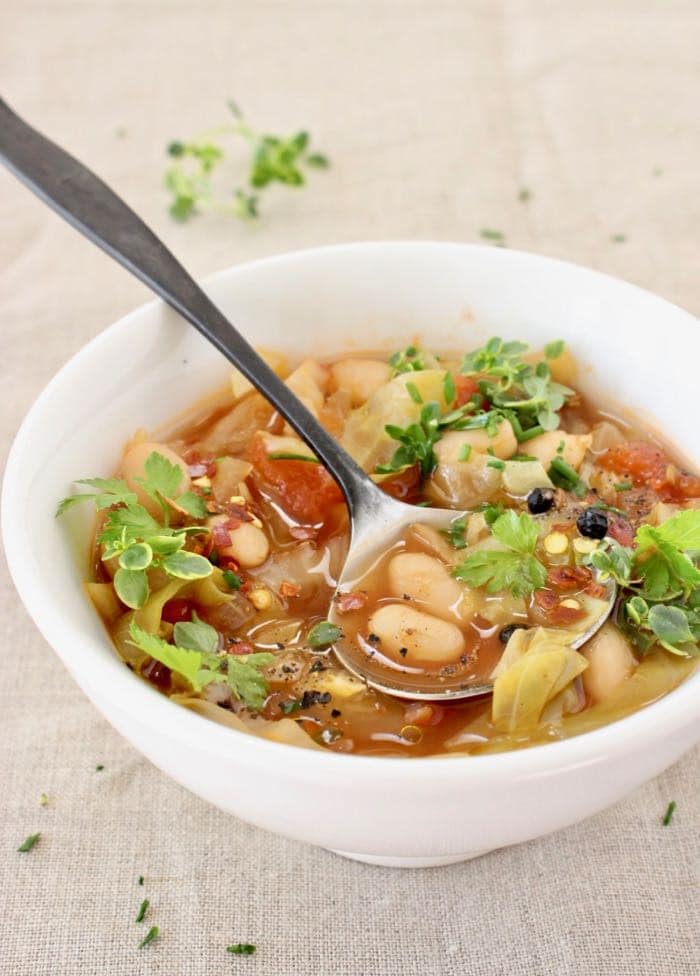 Vegan healthy cabbage and white bean soup recipe.