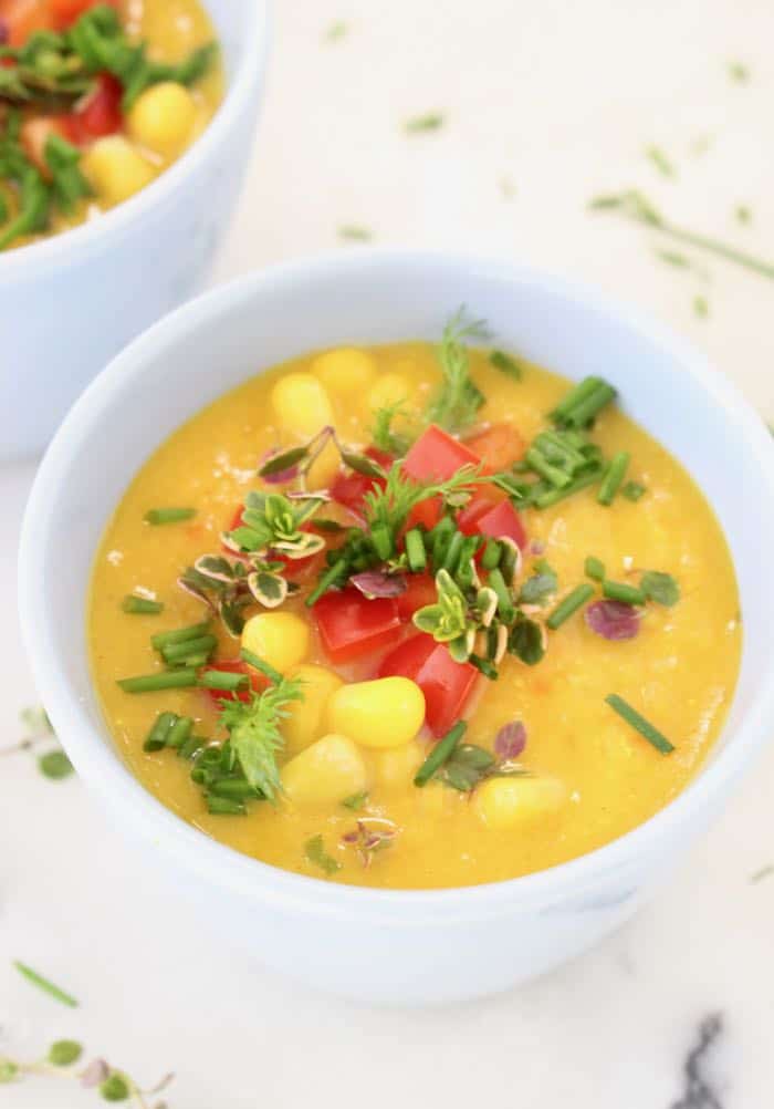 Vegan Potato Corn Chowder Bowls with fresh Herbs and Red Bell Pepper
