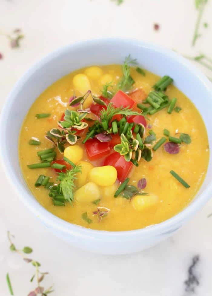 Vegan Potato Corn Chowder Bowls with fresh Herbs and Red Bell Pepper