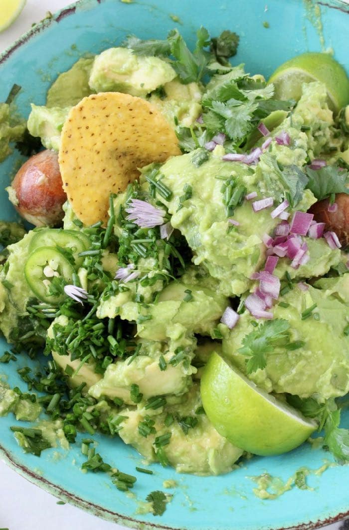 the Best Chunky Guacamole Recipe with Serrano Peppers, Cilantro and Lime.