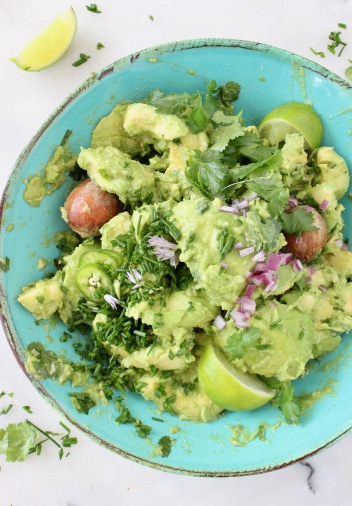 the Best Chunky Guacamole Recipe with Serrano Peppers, Cilantro and Lime.