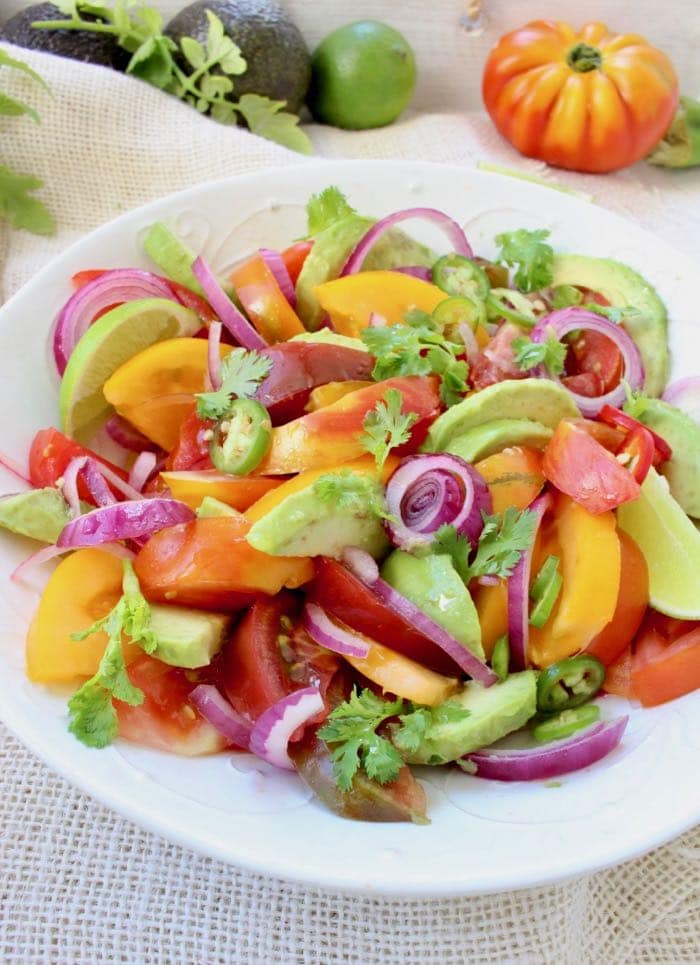 Avocado Tomato Salad Recipe with Lime Dressing, Cilantro and Purple Onions.