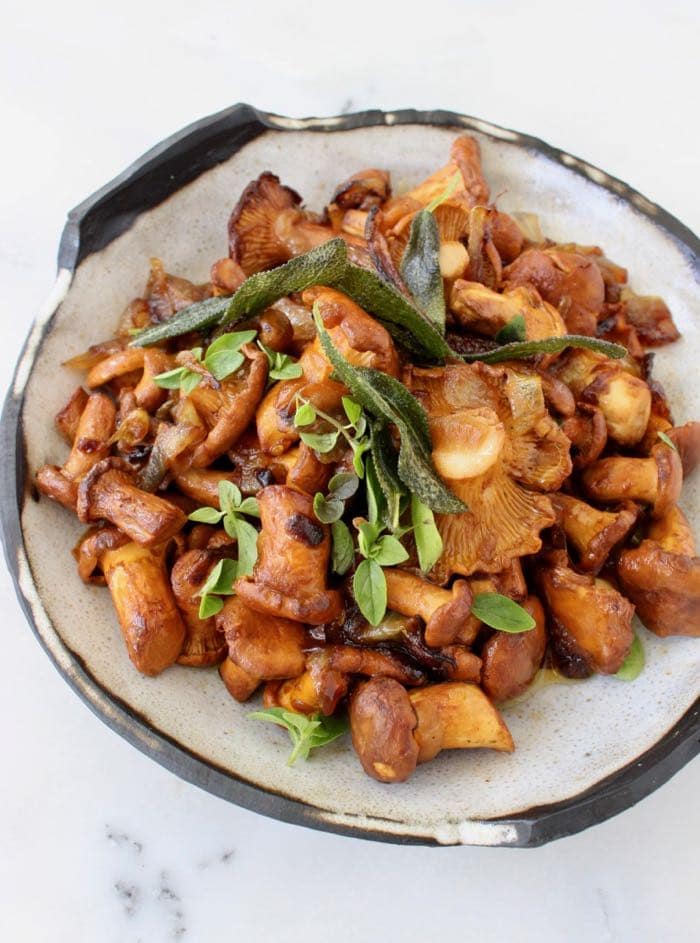 vegan potatoes and mushrooms recipe with caramelized onions and crispy sage.