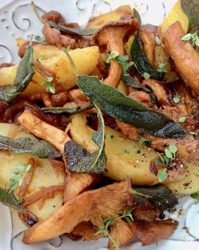 vegan potatoes and mushrooms recipe with caramelized onions and crispy sage.