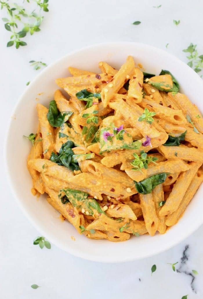 Creamy Vegan Roasted Red Pepper Pasta Sauce with Spinach and Cashews.