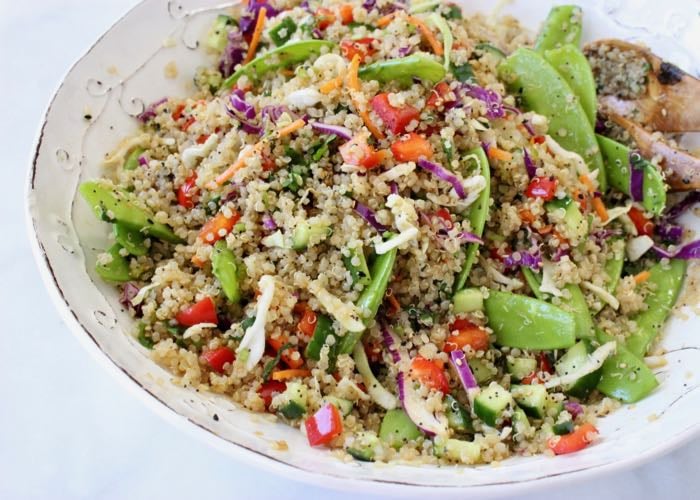 Asian quinoa salad recipe with cabbage, bell peppers and coco aminos dressing.