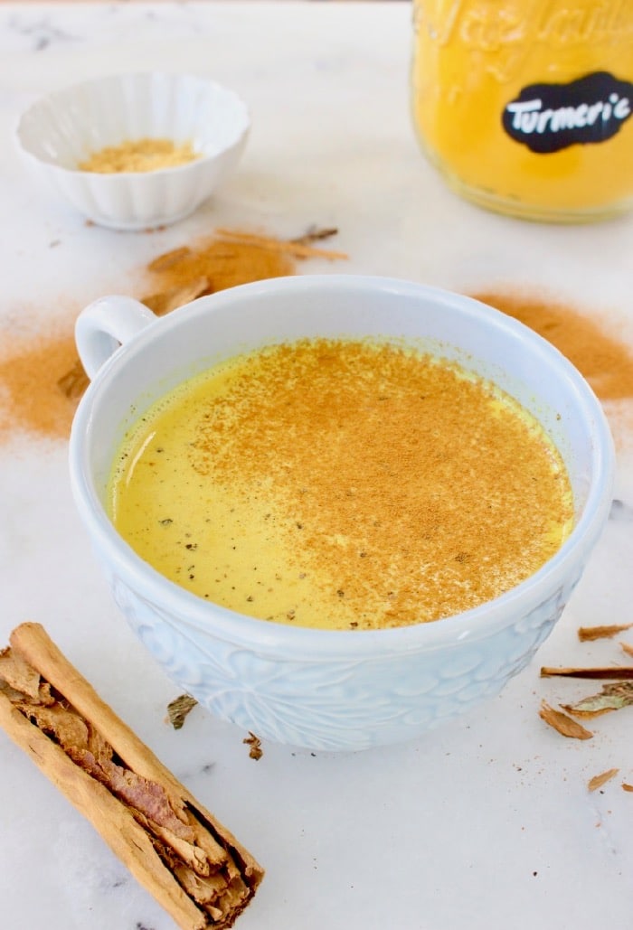 Easy golden turmeric latte recipe with hints of ginger and cinnamon, naturally sweetened with maple syrup.