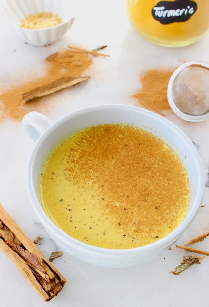 Easy golden turmeric latte recipe with hints of ginger and cinnamon.