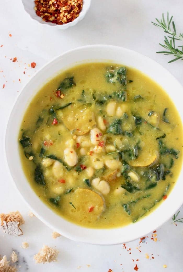 Tuscan White Bean Kale Soup recipe with winter squash, leeks, lacinato kale and creamy cannellini beans.