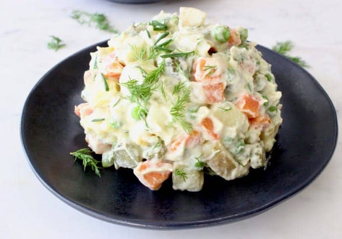 Vegan potato salad with oil-free aioli mayo, carrots, peas and dill.
