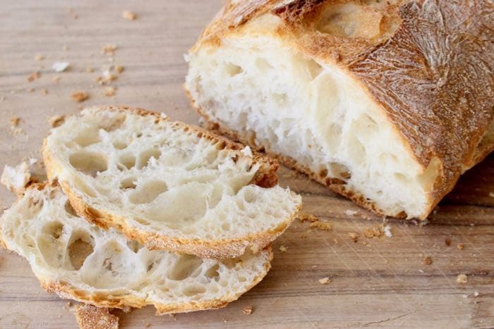 Easy Ciabatta Bread Recipe or " Italian Slipper Bread " crusty loaf with a soft and airy center.