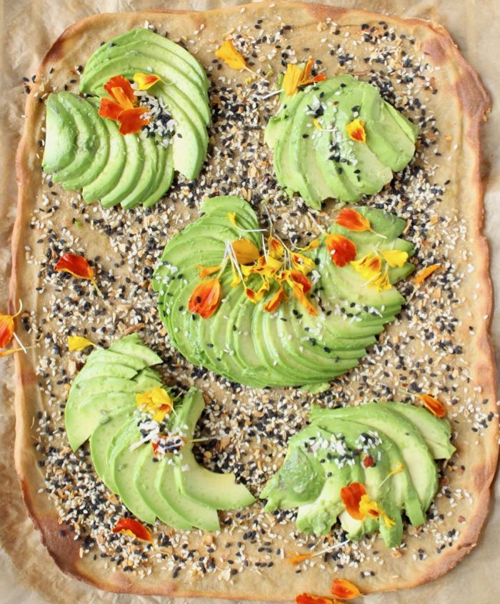 Quinoa flatbread with avocado and everything bagel seasonings.