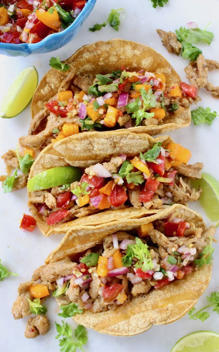 Vegan street tacos de carnitas with meaty soy curls and tomato salsa!