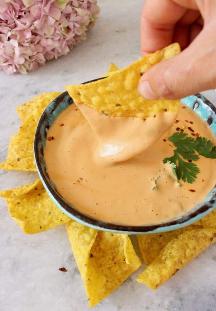 Cashew queso with tomato sauce and nutritional yeast.