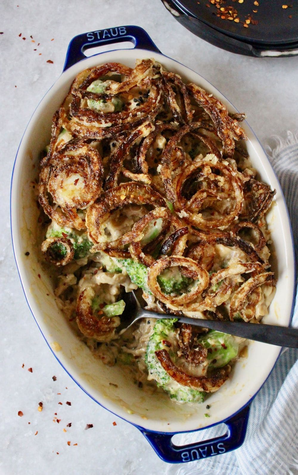 vegan broccoli casserole with crispy fried onions.