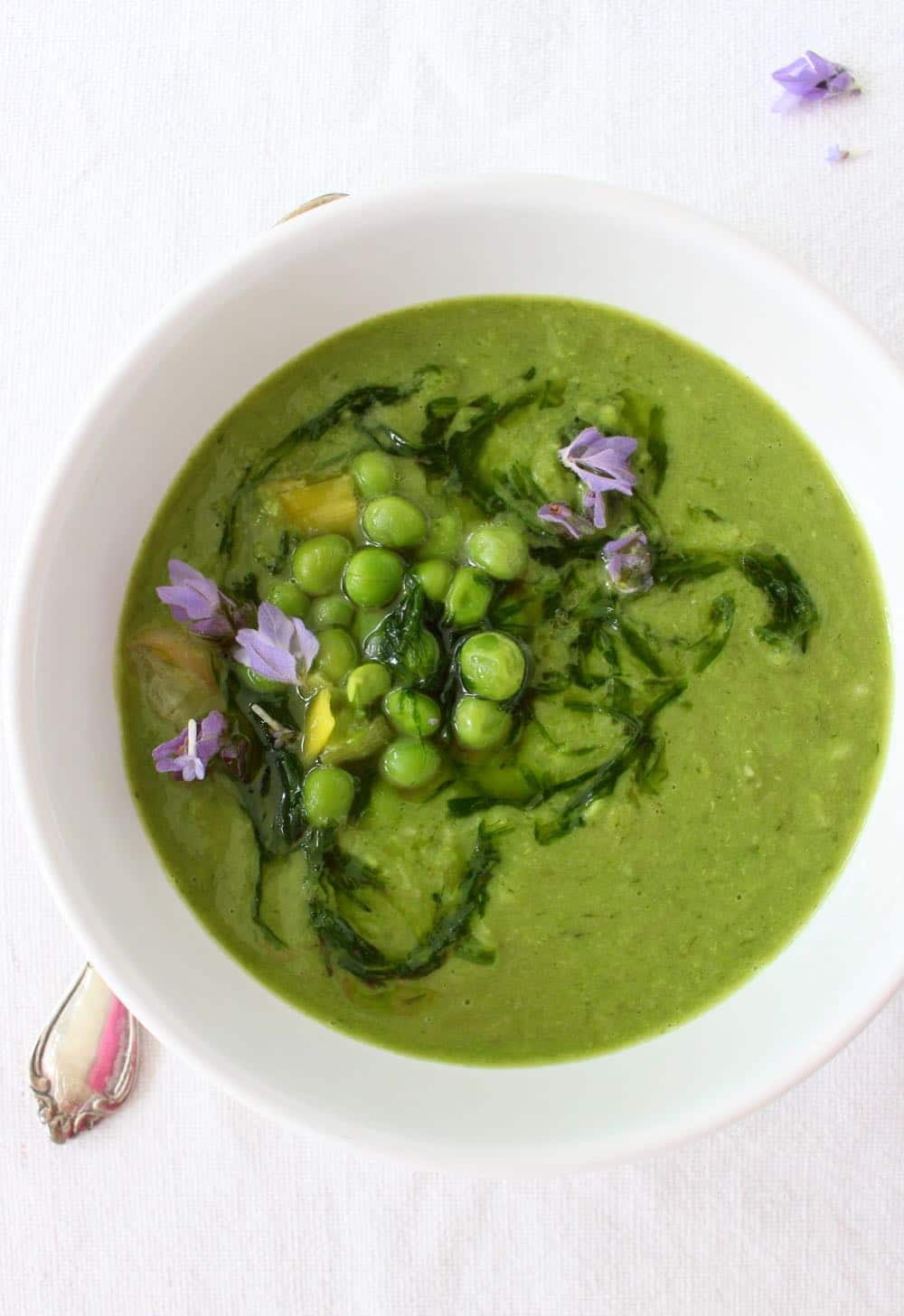 vegan green pea soup with leeks and chive oil