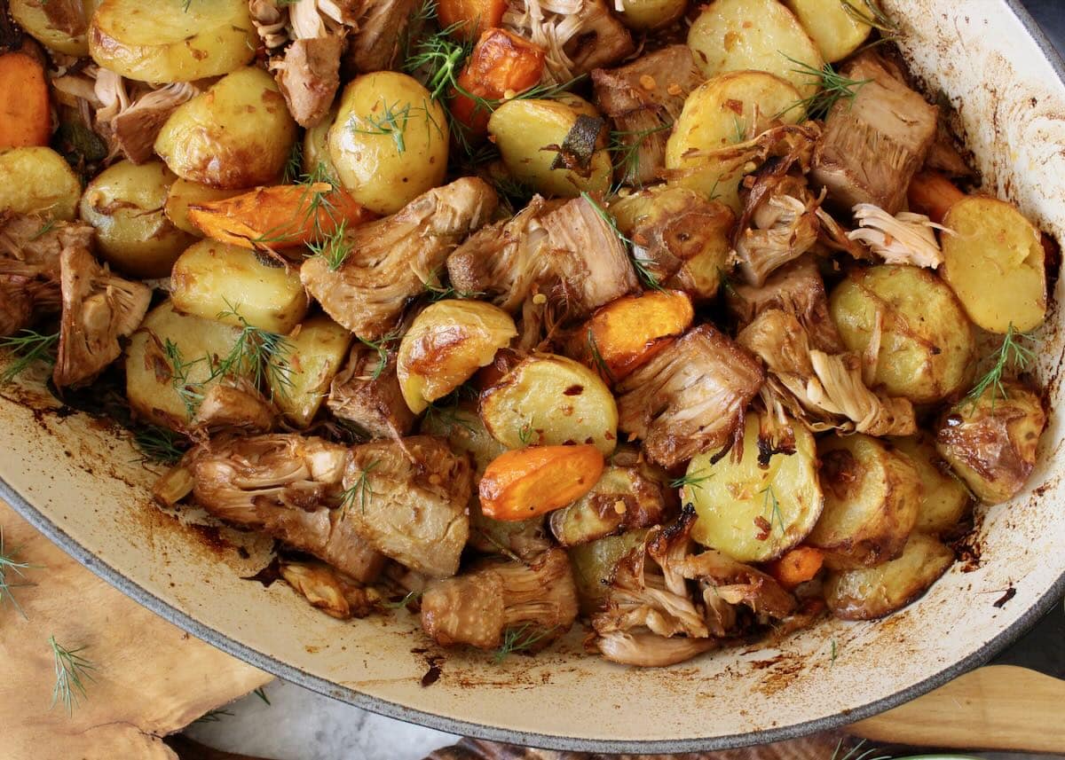 Vegan pot roast with jackfruit, potatoes and garlic.